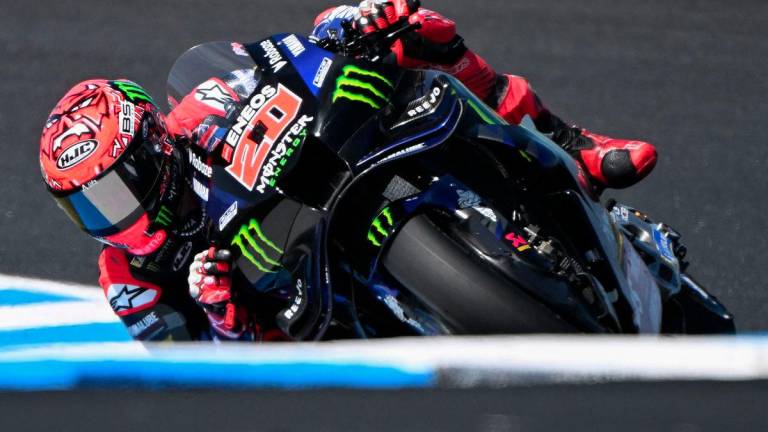 Monster Energy Yamaha MotoGP team's French MotoGP rider Fabio Quartararo races through a corner during qualifying for the Australian MotoGP Grand Prix on Phillip Island on 18 October, 2025. - AFPPIX