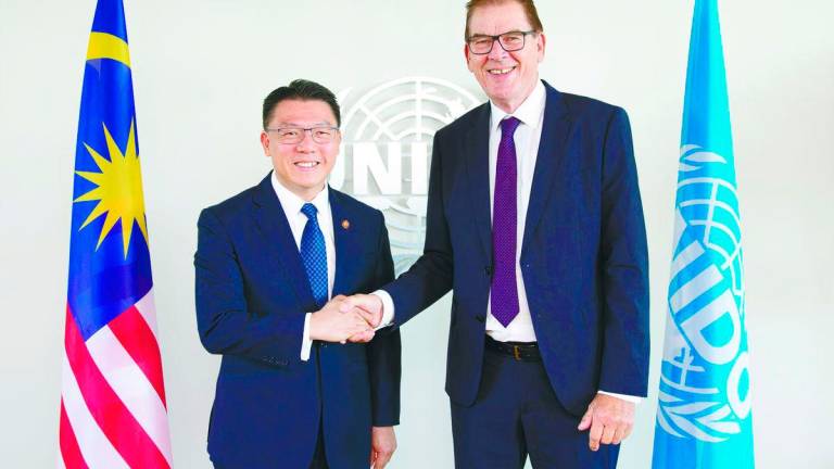Nga with Muller at the bilateral meeting in Vienna recently. – PIC COURTESY OF HOUSING AND LOCAL GOVERNMENT MINISTRY