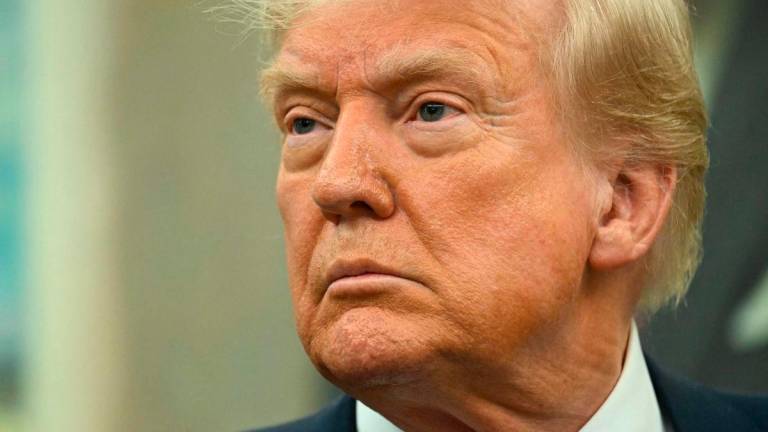 US President Donald Trump speaks during a swearing-in ceremony for the Ambassador to China, former Republican Senator of Georgia, David Perdue at the White House in Washington, DC, May 7, 2025. AFPpix