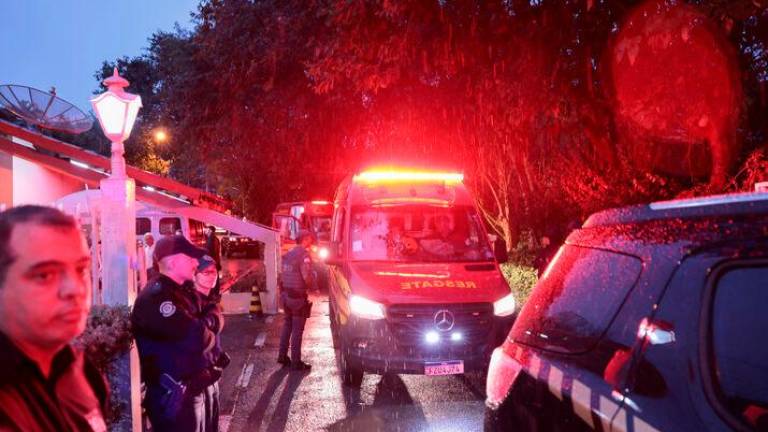 Authorities arrive at the site of a turboprop plane crash where all passengers and crew on board died, in Vinhedo, Brazil August 9, 2024. REUTERSPIX