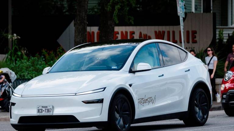 A Tesla robotaxi drives on the street along South Congress Avenue in Austin, Texas, U.S., June 22, 2025. - REUTERS/Joel Angel Juarez
