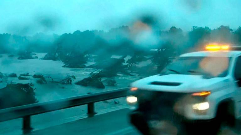 First responders survey rising flood waters of the Guadalupe River after flash flooding in Kerr County, Texas. ABC Affiliate KSAT via REUTERS.