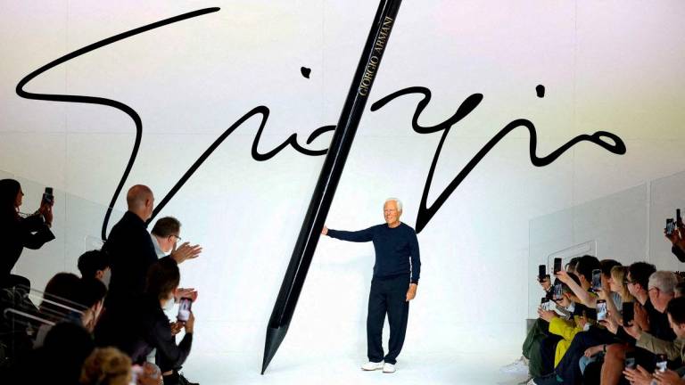 FILE PHOTO: Italian designer Giorgio Armani poses at the end of his Spring/Summer 2024 men’s collection show during Fashion Week in Milan, Italy, June 19, 2023. REUTERS/Claudia Greco/File Photo