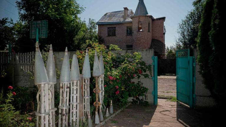 Collected remains of missiles in the courtyard near the house of Ukrainian farmer Petro Pylypaka in the de-occupied village of Ruski Tyshky, Kharkiv region on July 15, 2025, amid the Russian invasion of Ukraine. (Photo by Ivan SAMOILOV / AFP)