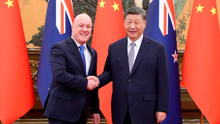 Chinese President Xi Jinping and New Zealand’s Prime Minister Christopher Luxon - China Daily via REUTERS