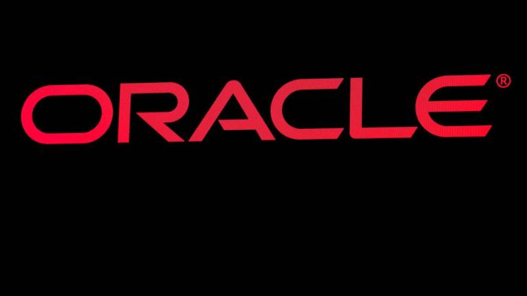 The company logo for Oracle Corp. is displayed on a screen. Reuterspix
