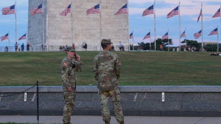 National Guard troops walk along the National Mall on August 8, 2025 in Washington, DC. GETTY IMAGES NORTH AMERICA / AFPPix