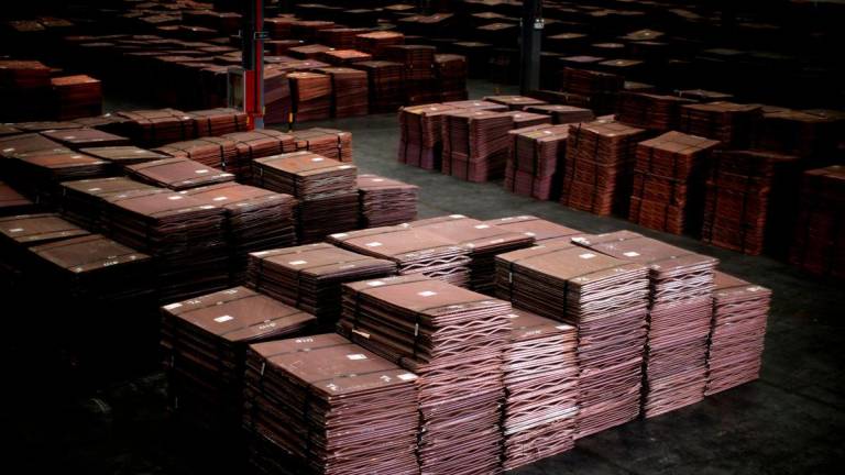 FILE PHOTO: Copper cathodes are seen inside a warehouse near Yangshan Deep Water Port, south of Shanghai March 23, 2012. REUTERS