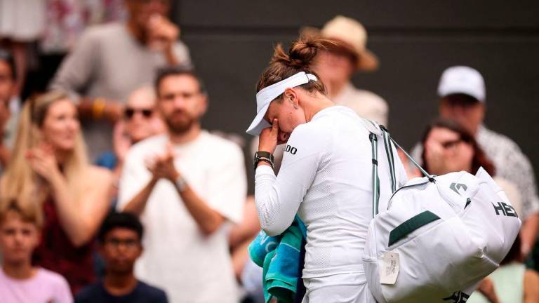 Czech Republic’s Barbora Krejcikova cries as she leaves Court 1 following her defeat against USA’s Emma Navarro at the end of their women’s singles third round tennis match on the sixth day of the 2025 Wimbledon Championships at The All England Lawn Tennis and Croquet Club in Wimbledon, southwest London, on July 5, 2025 -AFP