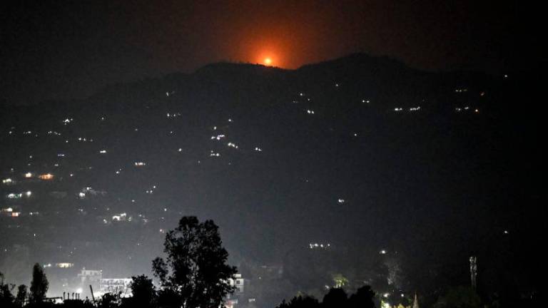 A flare goes up in air over the hill near main town of Poonch district, on May 7, 2025. AFPpix