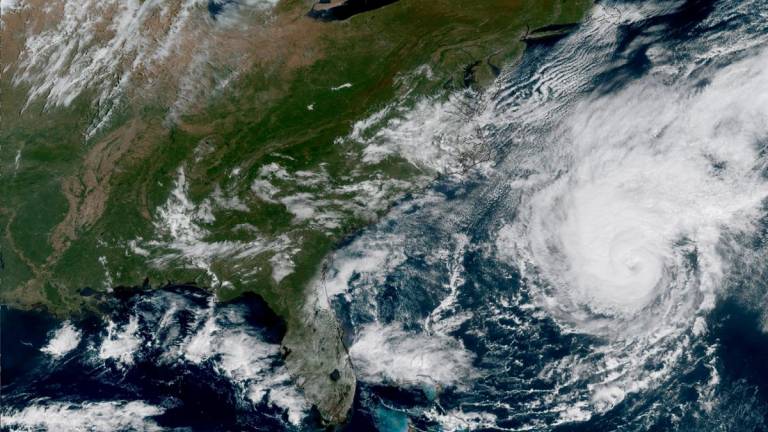 This satellite image provided by the National Oceanic and Atmospheric Administration (NOAA) shows Hurricane Imelda looming of the US South East Coast on October 1, 2025. - AFP PHOTO / NOAA