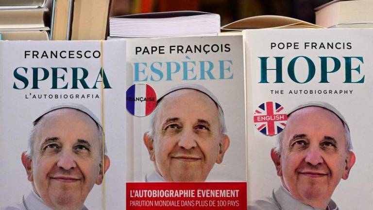 A bookshop displays autobiographies of Pope Francis in the shopwindow, near St Peter's square, in The Vatican on March 03, 2025.- AFPPIX