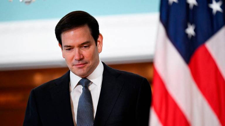 U.S. Secretary of State Marco Rubio looks down as he meets with Canadian Foreign Minister Anita Anand (not pictured) at the State Department, in Washington, D.C., U.S., August 21, 2025. REUTERS/Annabelle Gordon