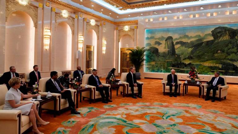 Rep. Adam Smith, (D-WA), speaks with Chinese Premier Li Qiang, as he leads a bipartisan group of U.S. lawmakers including Chrissy Houlahan, Democratic member of House Armed Services Committee, Ro Khanna, Democratic member of House Armed Services Committee, Michael Baumgartner, Republican member of House Foreign Affairs Committee and David Perdue, US Ambassador to China for a meeting at the Great Hall of the People in Beijing, China, Sunday, Sept. 21, 2025. Mahesh Kumar A./Pool via REUTERS