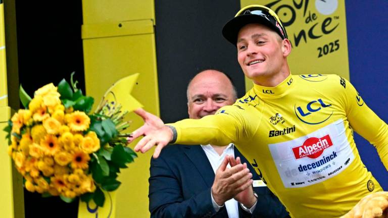 Alpecin - Deceuninck team’s Dutch rider Mathieu van der Poel celebrates on the podium with the overall leader’s yellow jersey after the 2nd stage of the 112th edition of the Tour de France cycling race, 209.1 km between Lauwin-Planque and Boulogne-sur-Mer, Northern France, on July 6, 2025 -AFP