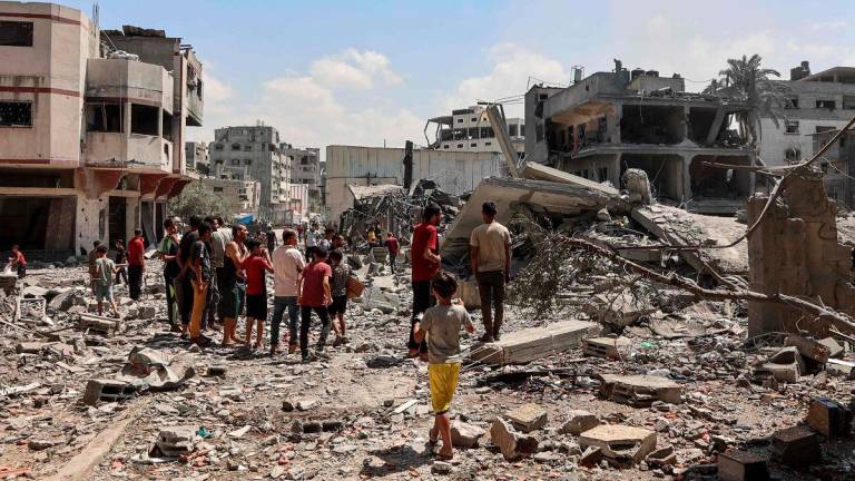 Palestinians check the rubble after an Israeli strike levelled the al-Tawheed Wal Sunna mosque in the Daraj neighbourhood of Gaza City on September 7, 2025. - Omar AL-QATTAA / AFP