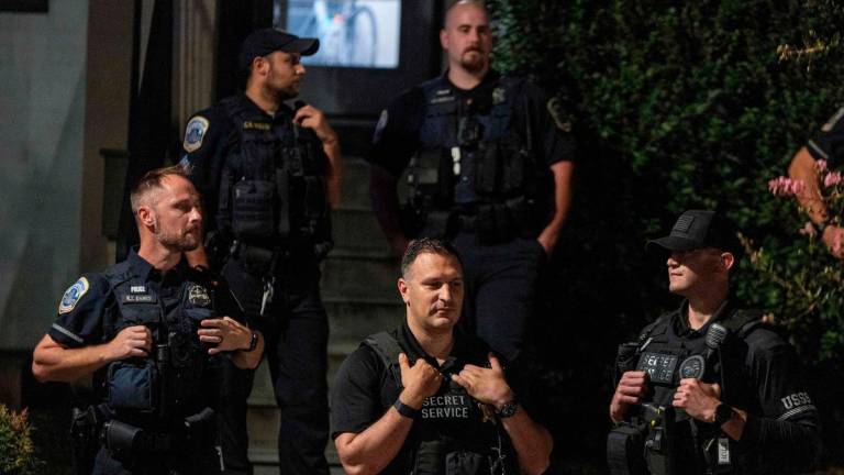 Washington DC Metro Police, Secret Service Police, FBI, HSI serve a search warrant on a home on 300 block of Sherman Ave NW on August 24, 2025 in Washington, DC. An increased presence of law enforcement has been seen throughout the nation’s capital since the Trump administration ordered in federal officers and the U.S. National Guard. Tasos Katopodis/Getty Images/AFP (Photo by TASOS KATOPODIS / GETTY IMAGES NORTH AMERICA / AFP)