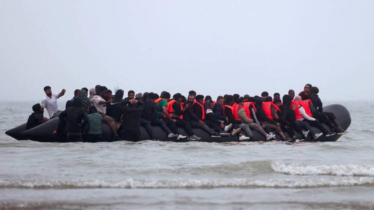 A group of migrants on an inflatable dinghy leave the coast of northern France in an attempt to cross the English Channel to reach Britain, from the beach of Petit-Fort-Philippe in Gravelines, near Calais, France, July 2, 2025. - REUTERSPIX