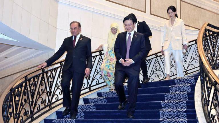 Prime Minister Datuk Seri Anwar Ibrahim, together with his Singaporean counterpart, Lawrence Wong, attend a Luncheon at Kompleks Seri Perdana today.- BERNAMAPIX