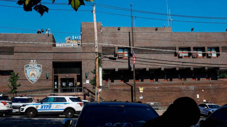 The U.S. flag hangs at half mast outside the 47th precinct, which was the police station for the New York Police Department’s Didarul Islam who was killed in the deadly mass shooting, outside the precinct in the Bronx borough of New York City - Reuterspix