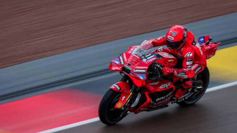 Ducati Lenovo Team's Spanish MotoGP rider Marc Marquez steers his bike during the third practice session of the MotoGP German motorcycle Grand Prix at the Sachsenring racing circuit, in Hohenstein-Ernstthal near Chemnitz, eastern Germany on July 12, 2025. - AFPPIX
