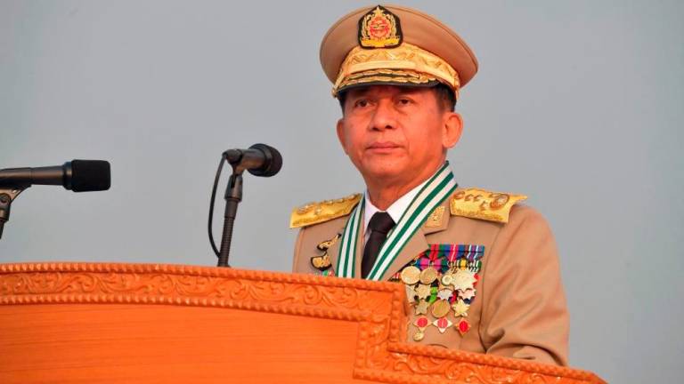 This handout photo taken and released on March 27, 2022 by the Myanmar Military Information Team shows Chief Senior General Min Aung Hlaing attending a ceremony to mark the country’s 77th Armed Forces Day in Naypyidaw. -AFPPIX