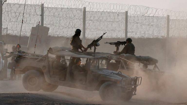 Israeli military vehicles operate, near the Israel-Gaza border, in Israel, August 16, 2025. REUTERS/Amir Cohen TPX IMAGES OF THE DAY