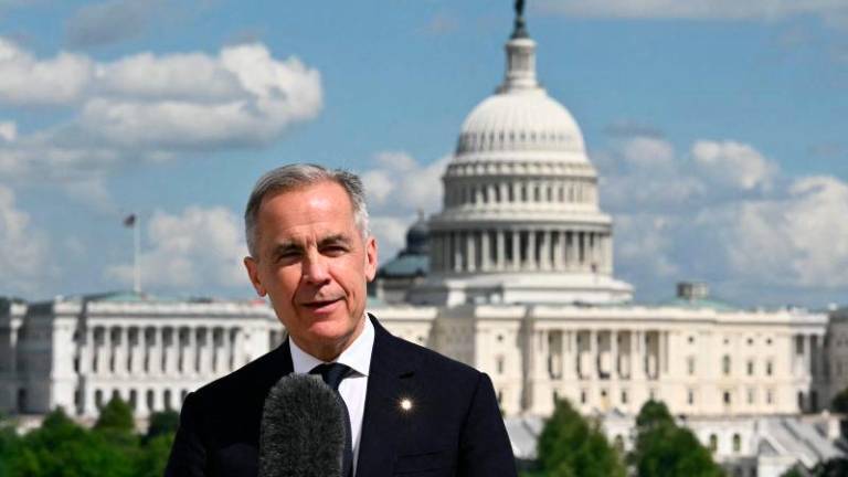 Canadian Prime Minister Mark Carney speaks to the media after a meeting with US President Donald Trump at the Embassy of Canada to the United States in Washington, DC, on May 6, 2025. AFPpix