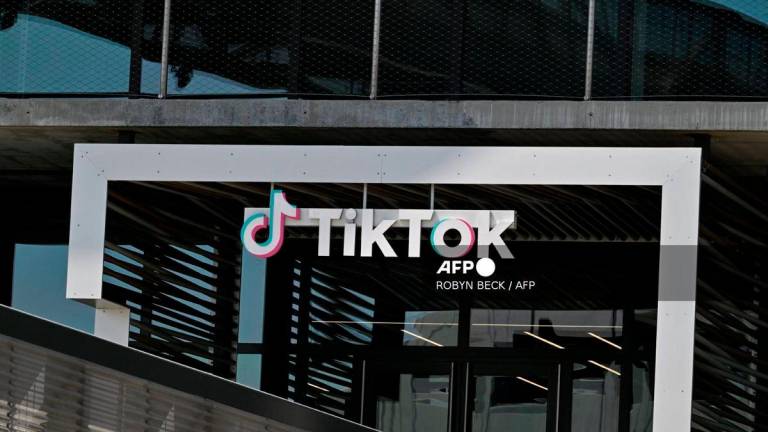 (FILES) The TikTok logo is seen outside the Chinese video app company’s Los Angeles offices on April 4, 2025 in Culver City, California. China said on September 26, 2025 it hoped the United States would provide open and fair treatment for TikTok and other Chinese companies investing in the country, after President Donald Trump signed an executive order on a proposed deal for a US version of the popular app. - AFP