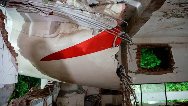 A view shows debris at the crash site after an Air India aircraft - REUTERSPIX