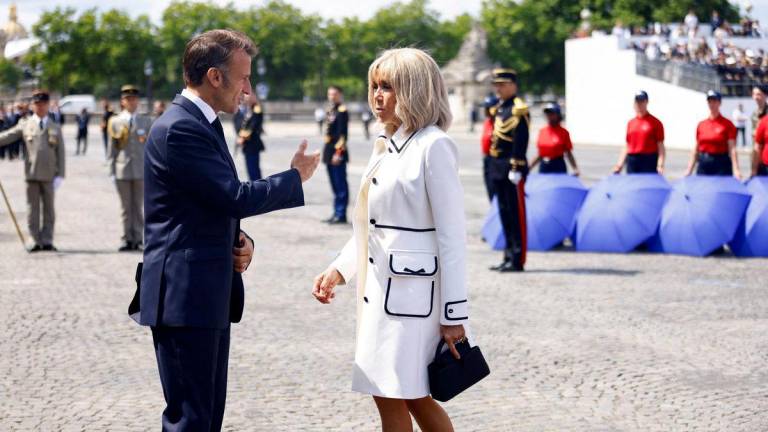 French President Emmanuel Macron and his wife Brigitte - Mohammed Badra/Pool via REUTERS/File Photo