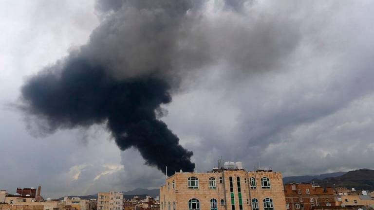 Smoke billows after an Israeli air strike on Yemen’s Huthi-held capital Sanaa on August 24, 2025. The Israeli army said it targeted Huthi military sites in the Yemeni capital Sanaa on August 24, including areas near the presidential palace along with power plants and a fuel storage facility. (Photo by Mohammed HUWAIS / AFP)