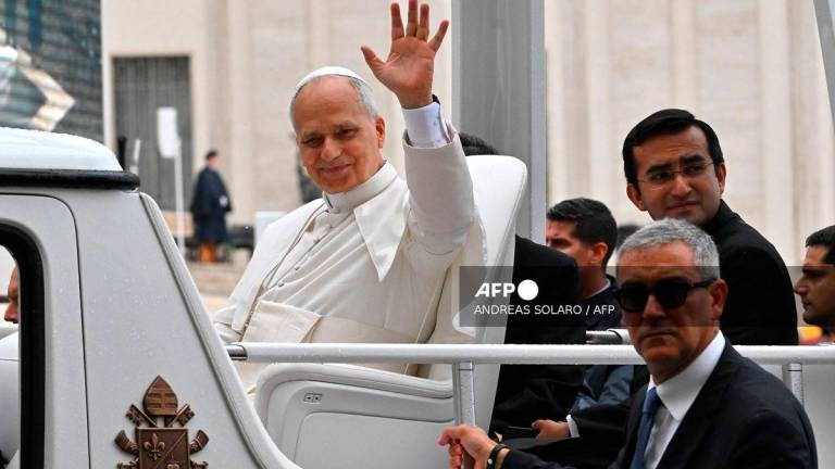 Pope Leo XIV waves as he leaves the weekly general audience at St. Peter’s square in the Vatican on September 10, 2025. (Photo by Andreas SOLARO / AFP)