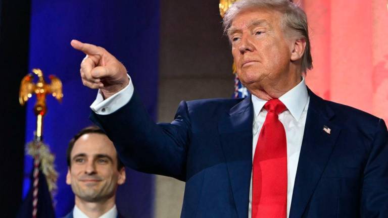 US President Donald Trump gestures after signing an executive order on artificial intelligence at the “Winning the AI Race” AI Summit at the Andrew W. Mellon Auditorium in Washington, DC - AFPPix