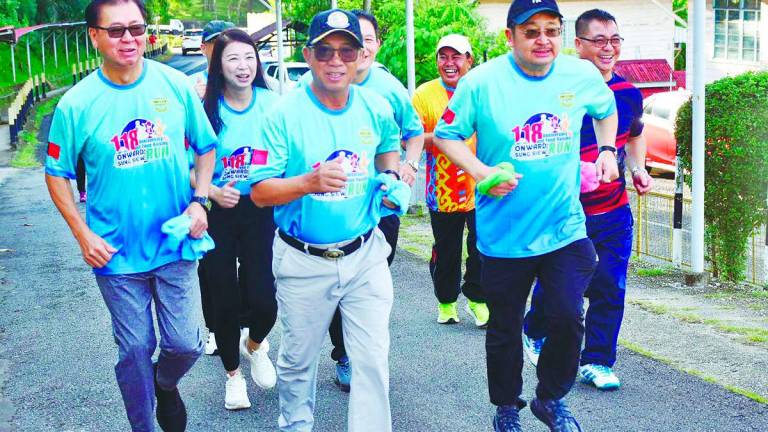 Joachim (centre) leads runners at the Onward Sung Siew Run