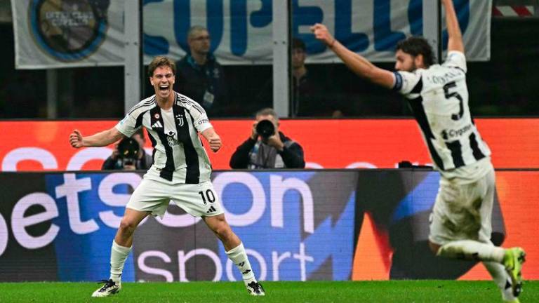 Juventus' midfielder #10 Kenan Yildiz celebrates scoring his team's fourth goal during the Italian Serie A football match between Inter Milan and Juventus at San Siro stadium in Milan, on October 27, 2024. - AFPPIX