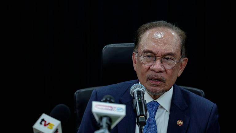 Prime Minister Datuk Seri Anwar Ibrahim speaks at a press conference after paying a courtesy visit at the ASEAN Secretariat today. - BERNAMAPIX