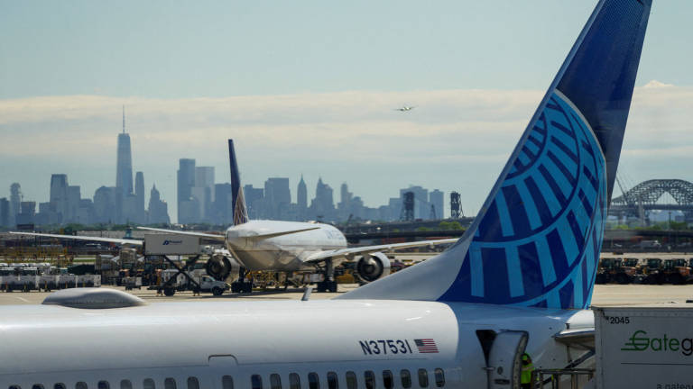 A view shows United Airlines at the tarmac at Newark International Airport, as the skyline of New York is seen in the background from Newark, New Jersey, U.S., May 7, 2025. - REUTERS