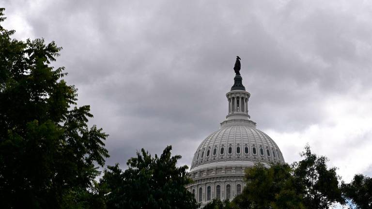 A view of the US Captiol building on the tenth day of the federal government shutdown on October 10, 2025, in Washington, DC. - AFP