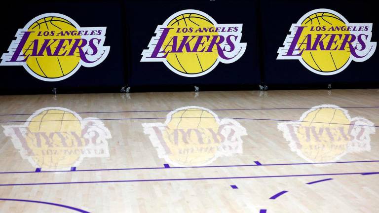 (FILES) The Los Angeles Lakers logo is seen before a press conference at UCLA Health Training Center on September 25, 2024 in El Segundo, California. The Los Angeles Lakers are being sold in a record-breaking $10 billion deal that makes the iconic franchise the highest-valued sports team in US history, ESPN reported on June 18, 2025 - AFPpix