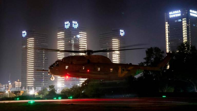 An Israeli helicopter with released hostages prepares to land at Tel Aviv's Schneider medical centre on November 24, 2023. - AFPPIX