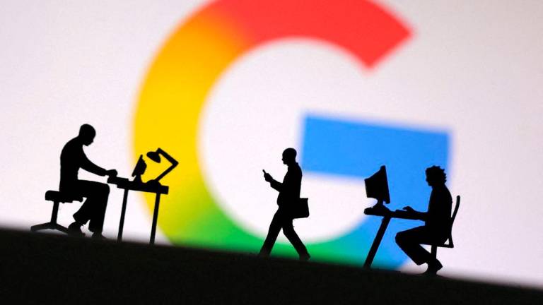 Miniature figures of people are seen in front of the new Google logo in this illustration taken May 13, 2025. REUTERSpix
