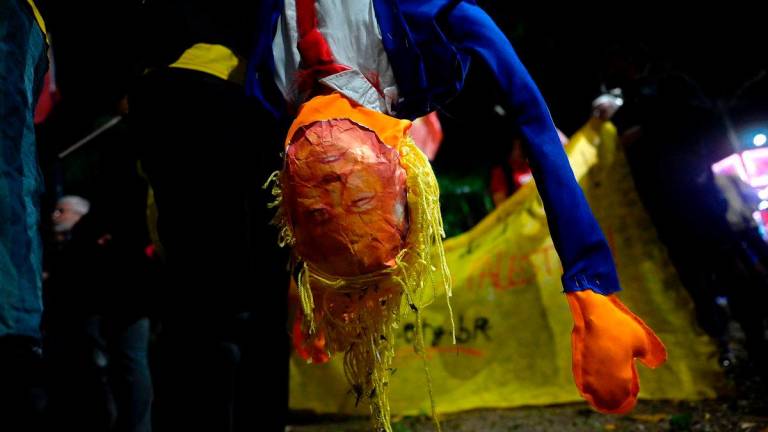 A person holds a dummy depicting US President Donald Trump during a protest in defense of national sovereignty after trade tariffs and sanctions were imposed by the US government on Brazil, near the US consulate in Rio de Janeiro, Brazil - AFPPix