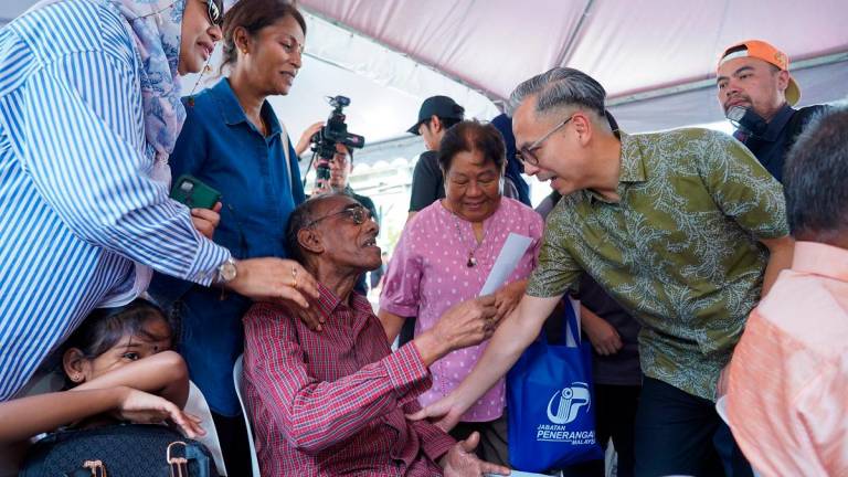 Fahmi engaging with the public during the carnival. – AMIRUL SYAFIQ/THESUN