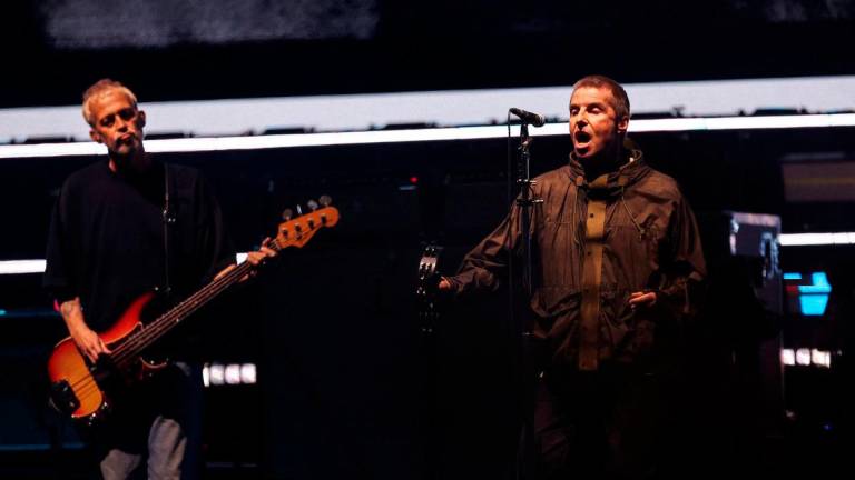 Liam Gallagher and Gem Archer of Oasis perform, during the first of their sellout comeback shows, at the Cardiff Principality Stadium, in Cardiff, Wales, Britain - REUTERSPix