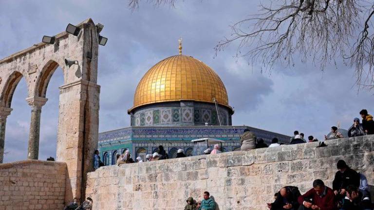 Muslim worshippers prepare to offer Friday Noon prayers at the Dome of the Rock shrine in Jerusalem - AFPpix