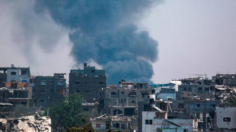 A column of smoke rises amid Israeli bombardment in the east of Jabalia in the northern Gaza Strip on June 16, 2025. - Bashar TALEB / AFP