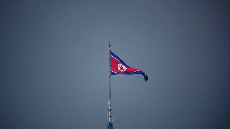 FILE PHOTO: A North Korean flag flutters at the propaganda village of Gijungdong in North Korea, in this picture taken near the truce village of Panmunjom inside the demilitarized zone (DMZ) separating the two Koreas, South Korea, July 19, 2022. REUTERS/Kim Hong-Ji/Pool/File Photo