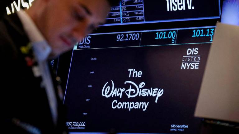 A screen shows the trading information and company logo for The Walt Disney company on the floor at the New York Stock Exchange (NYSE). Reuterspix