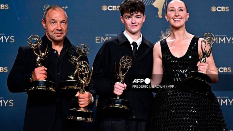 (L-R) Stephen Graham , Owen Cooper and Erin Doherty won the award for “Adolescence” during the 77th Primetime Emmy Awards at the Peacock Theatre at LA Live in Los Angeles on September 14, 2025. (Photo by Frederic J. Brown / AFP)